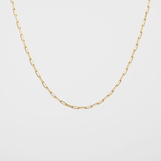 A gold vermeil paperclip chain necklace on a white background.