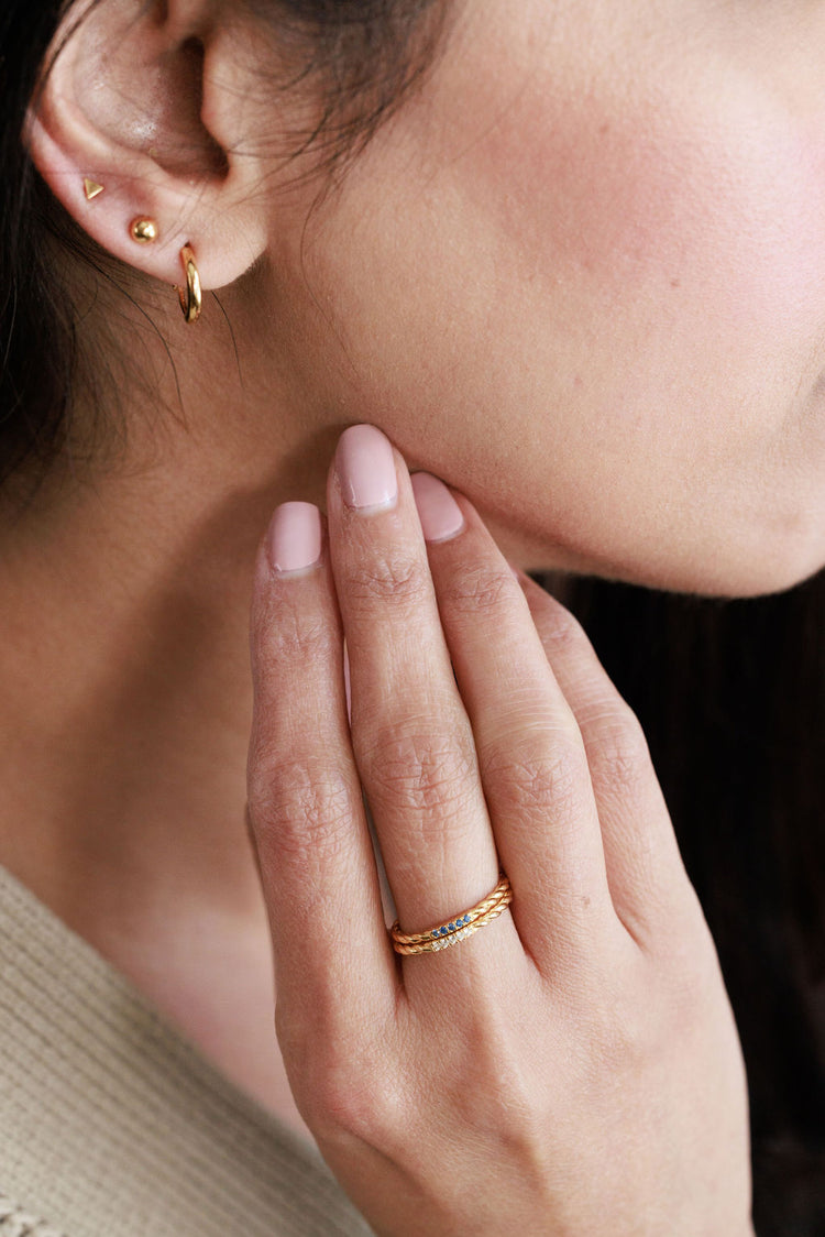 Blue sapphire and white topaz gold stacking rings