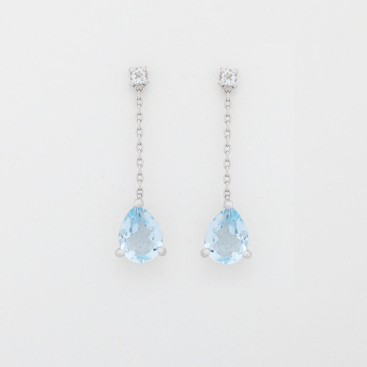 Pear cut blue topaz dangle earrings set in silver for bride