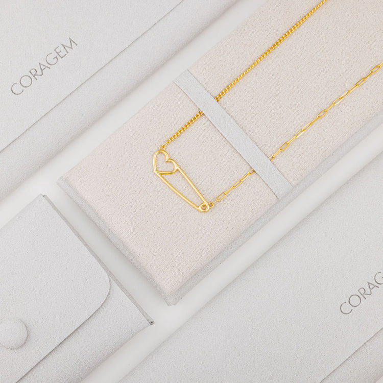 gold heart necklace in grey jewelry case