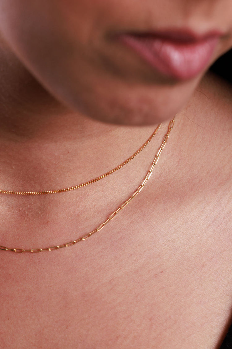 dainty gold chains with a paperclip chain and curb chain