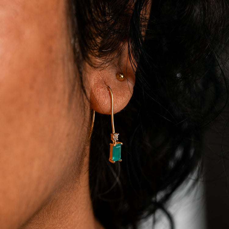 Close-up shot of green onyx dangle earrings