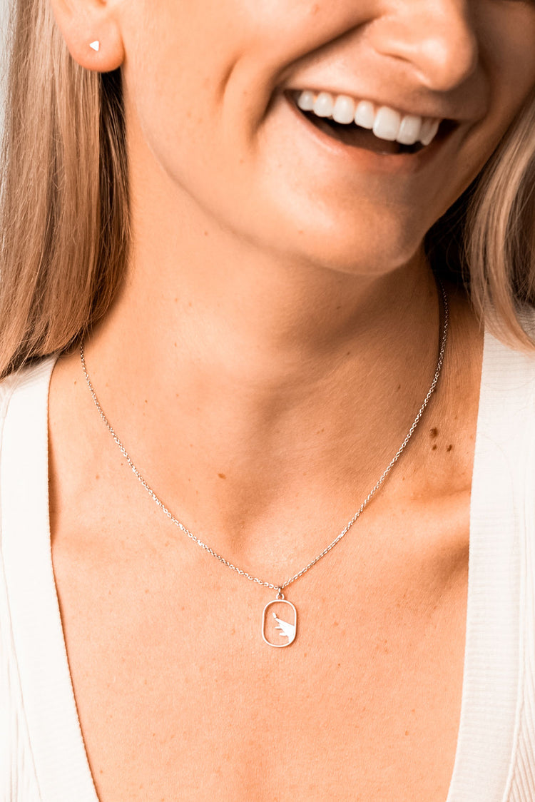 silver triangle earrings with a airplane necklace in silver