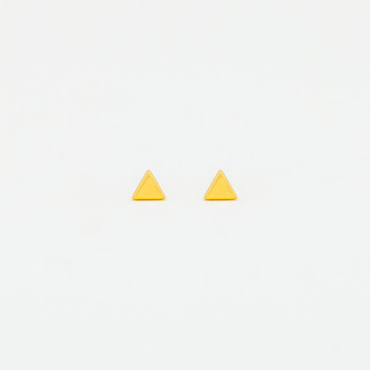 A pair of yellow gold vermeil triangle stud earrings on a white background.