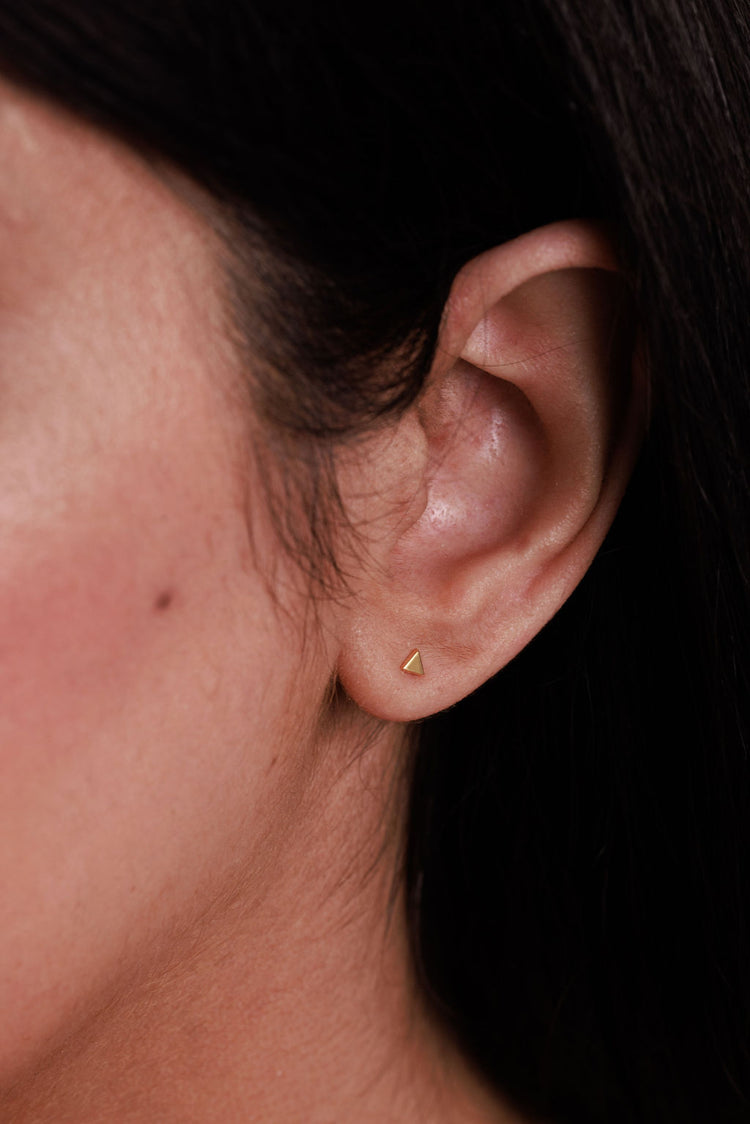 dainty gold triangle earrings in gold vermeil