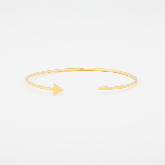 A gold vermeil triangle cuff bracelet on a white background