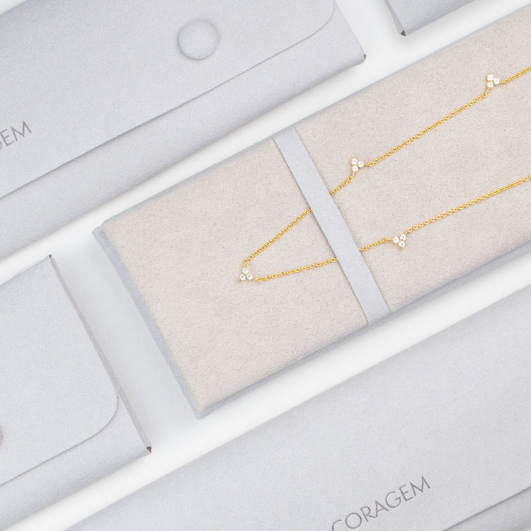 Gold trillion necklace with gift box