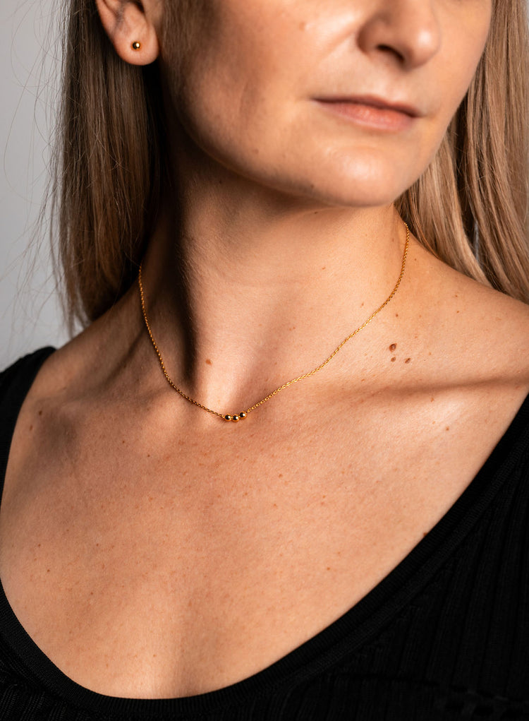 Trio ball pendant on delicate gold chain