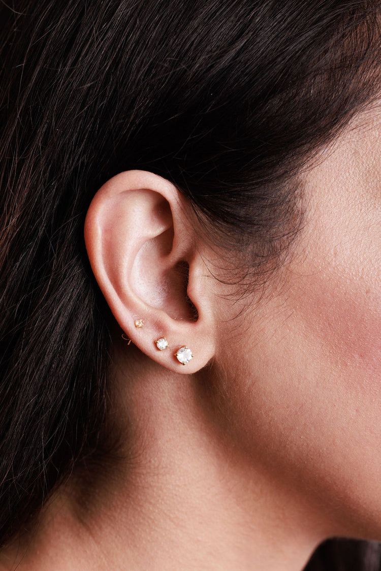 white topaz stud earrings stacked