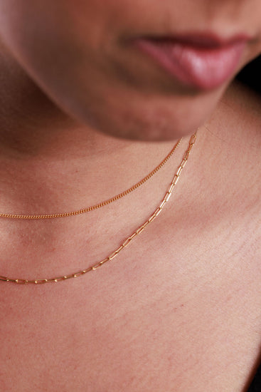 dainty gold chains with a paperclip chain and curb chain