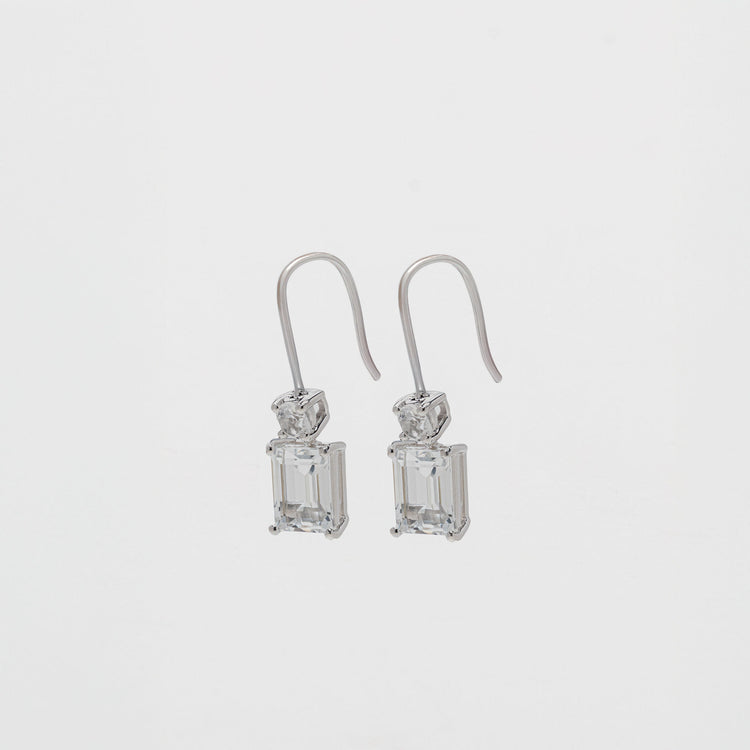 white topaz baguette cut drop earrings with a white topaz round stone set in silver