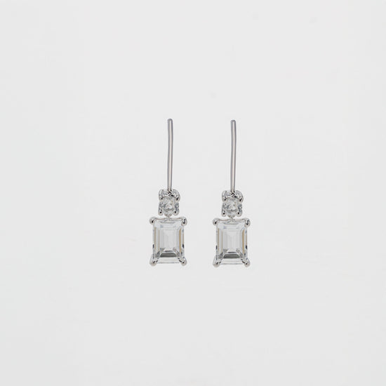 White topaz baguette drop earrings set in sterling silver