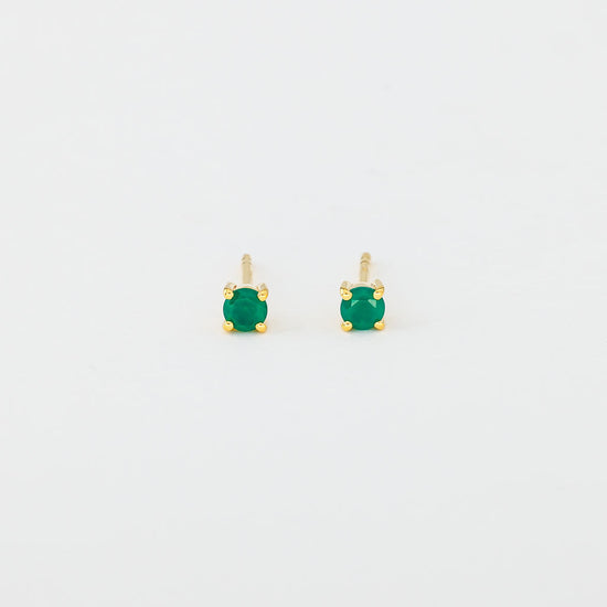 A pair of round green onyx stud earrings set in gold vermeil mounting.